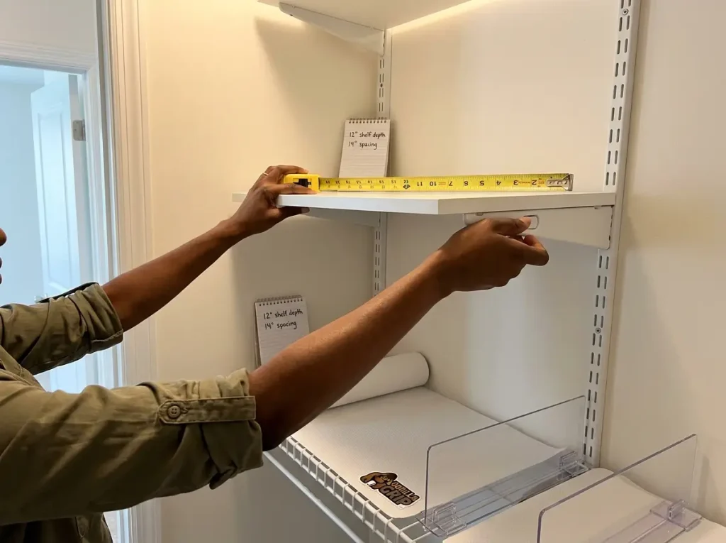 Why Your Closet Shelf Piles Keep Falling Over 3 Hands adjusting closet shelf bracket on track system with tape measure showing shelf depth