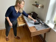 Desk Organization That Stays Neat Past the First Week Woman organizing a home office desk with zones and a bamboo drawer organizer on a compact apartment desk