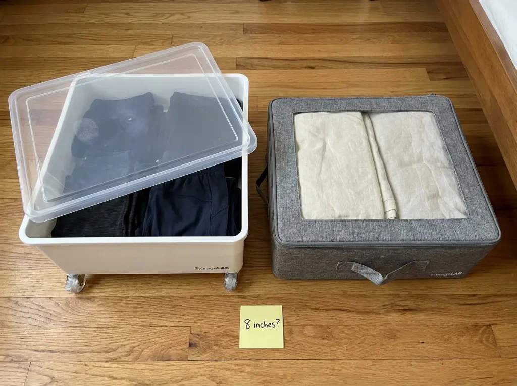 Rolling and flat under-bed storage containers compared side by side on bedroom floor showing wheel mechanism and height