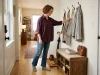 5 Entryway Bench Storage Ideas That Actually Fit Small entryway with storage bench, wall hooks, and boot tray in an organized apartment hallway