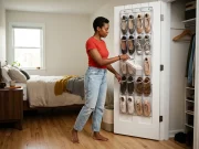 Over-Door Shoe Storage That Won’t Wreck Your Door Over-door clear pocket shoe organizer on a bedroom closet door with a woman pulling out one sneaker