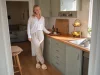 12 Kitchen Counter Organization Ideas That Stay Clear Bright kitchen with counter organized using a tray, turntable and wall shelf, one clear prep zone