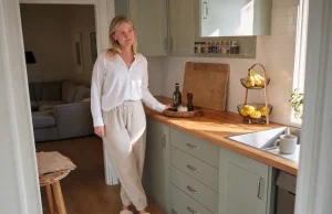 12 Kitchen Counter Organization Ideas That Stay Clear Bright kitchen with counter organized using a tray, turntable and wall shelf, one clear prep zone