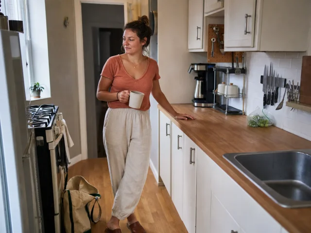 Small kitchen counter storage kept clear with only daily-use items on a tidy galley counter