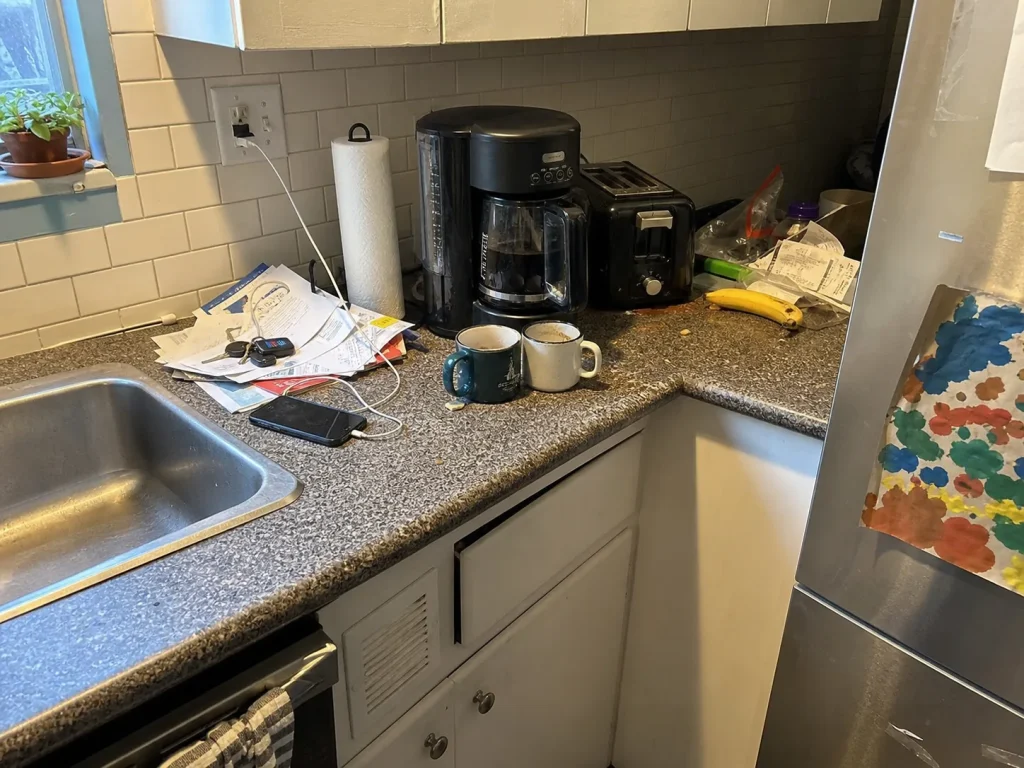 How to Organize Kitchen Counters That Stay Clear 1 Kitchen counter drifting back to clutter with mail, mugs, and a small appliance crowding the prep space
