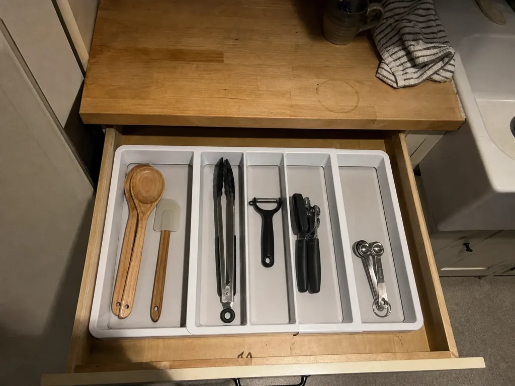 Best Kitchen Drawer Organizers That Hold Their Size 4 White madesmart expandable utensil tray sorting cooking tools inside a shallow kitchen drawer