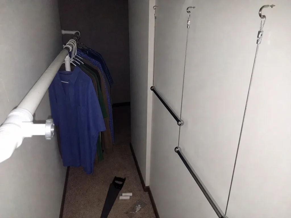 DIY closet rod build with PVC pipe and a wire-rope hanging rod inside a deep closet