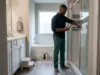 How to Organize Shower Products in a Shared Bath Man sorting shower products into two corner caddies while organizing a shared bathroom shower