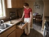 Spice Drawer vs Spice Rack? Your Tape Measure Decides Spice drawer open below a countertop spice rack in a kitchen, both storage options side by side
