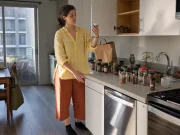 Spice Organization That Keeps Spices Fresh and Findable Woman sorting spice jars on a kitchen counter mid spice organization reset in a rental apartment