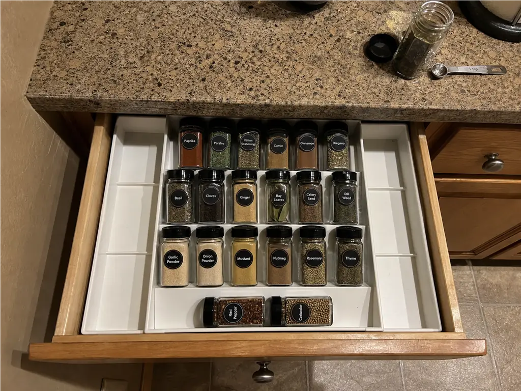 Spice Drawer vs Spice Rack? Your Tape Measure Decides 1 Expandable tiered spice tray inside a kitchen drawer showing what a spice drawer setup actually is