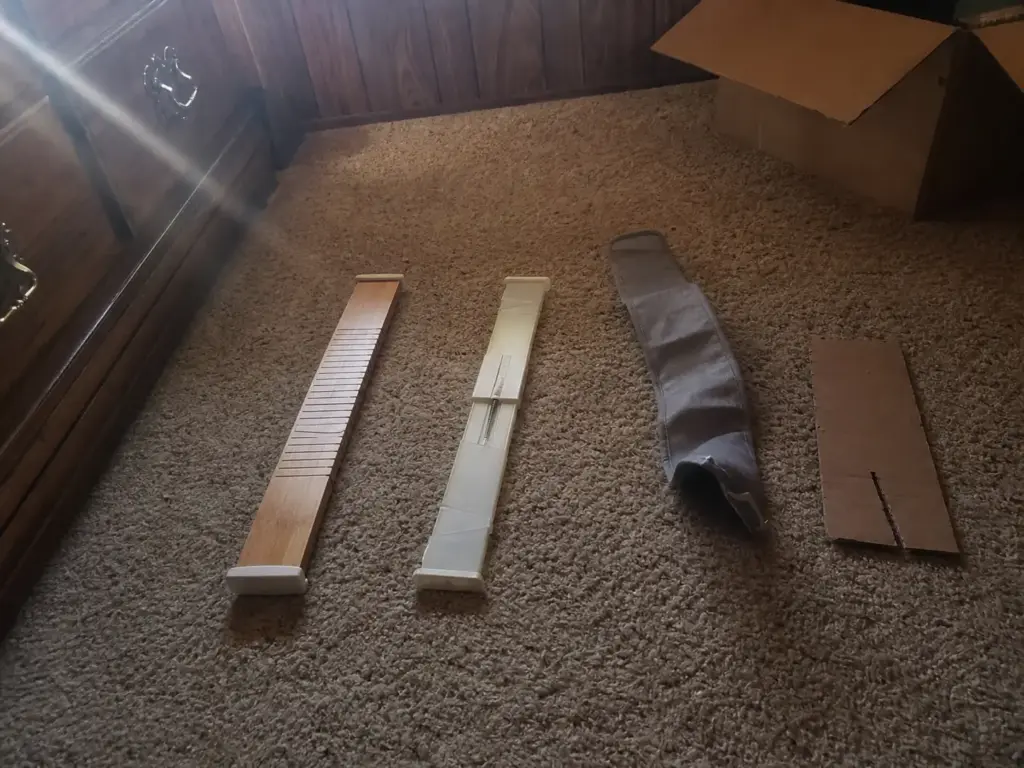 Best Drawer Dividers for Dressers That Actually Fit 2 Bamboo, plastic and fabric drawer dividers laid side by side on a carpeted bedroom floor
