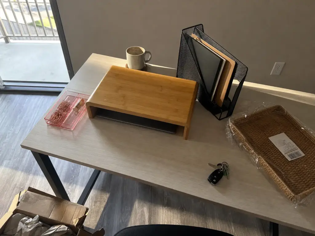 Aesthetic Desk Organization Ideas That Survive Week Two 2 Mismatched desk organizers in bamboo, black metal and pink acrylic showing material palette clash