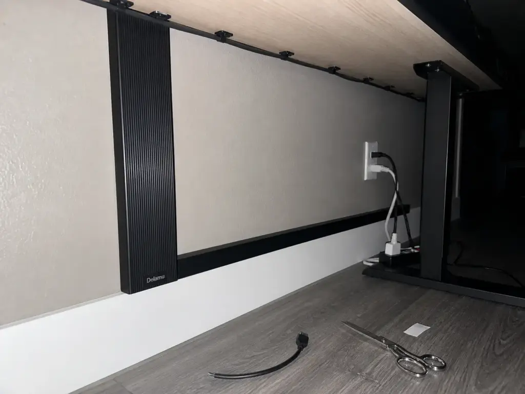 Aesthetic Desk Organization Ideas That Survive Week Two 3 J-channel cable raceway concealing desk cords down to the baseboard in a rental apartment