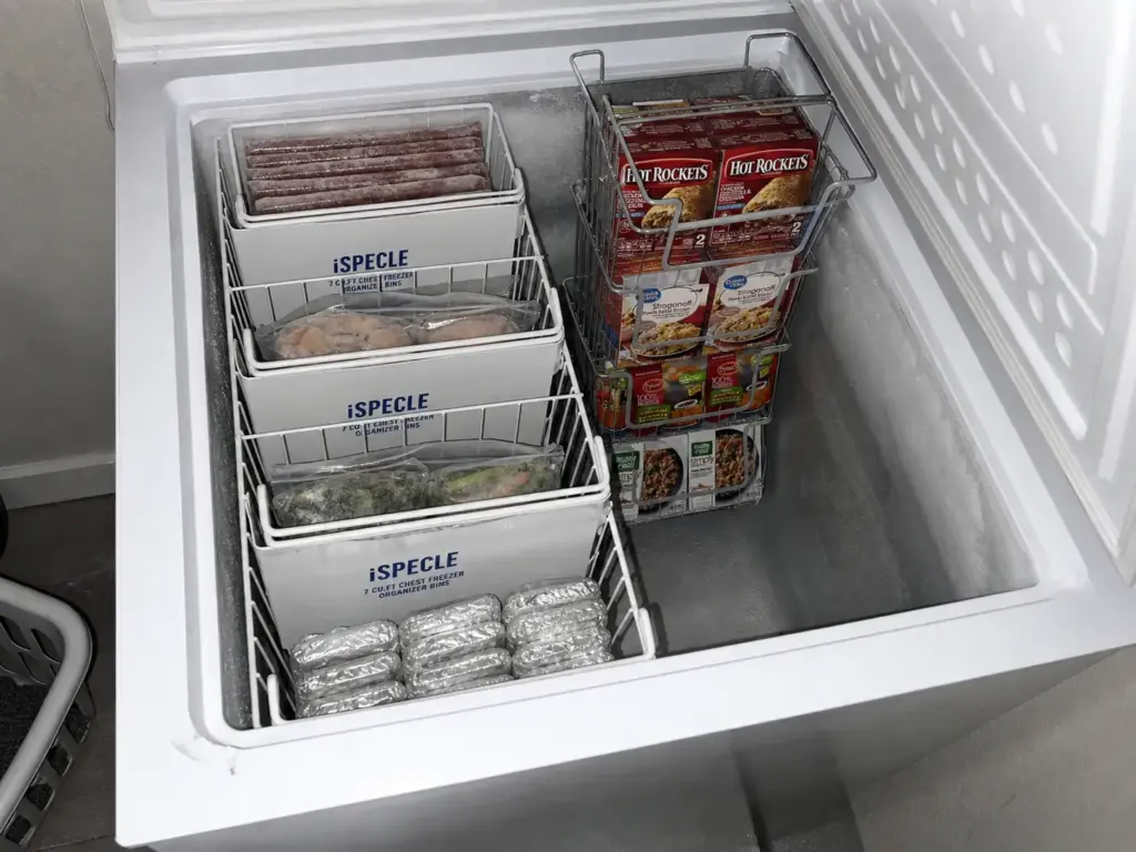 Chest freezer organized with lift-out baskets in zones, ending the layer-by-layer archaeology dig