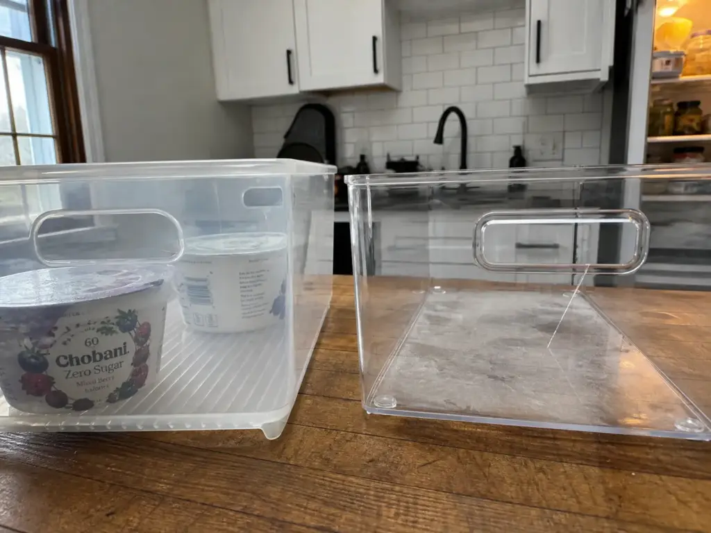 Hands measuring the vertical clearance between two refrigerator shelves with a tape measure
