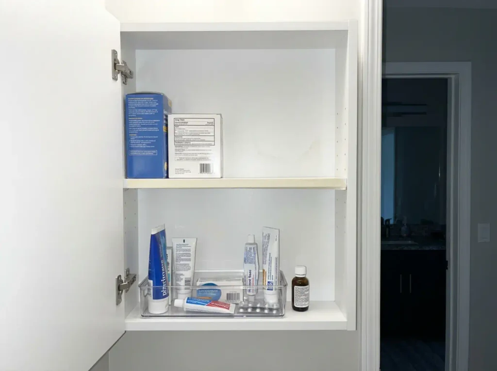 Medicine cabinet three months on with daily items moved down to the reachable shelf