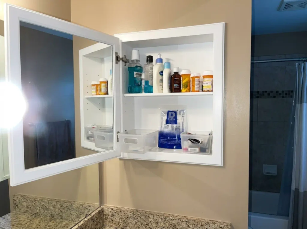 Medicine Cabinet Organization for 3-Inch Shelves 7 Silica gel packet tucked at the back of an organized medicine cabinet shelf to manage bathroom humidity